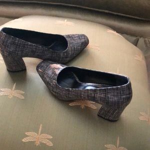 Black and white patent leather heels